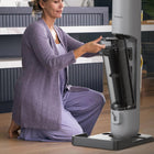 Tineco - Aspirateur à balai sans fil GO Station avec station de recharge et vidage automatique-Illuminez et éliminez : Notre fonctionnalité GreenReveal expose la poussière et les débris invisibles avec un faisceau LED vert à contraste élevé, garantissant qu'aucune saleté ne soit laissée