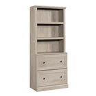 Sauder - Bibliothèque avec tiroirs - Châtaignier crayeux-Rangement multi-pièces: cette bibliothèque fonctionnelle à tiroirs peut répondre à vos besoins de rangement dans différentes pièces: salon, buanderie, cuisine, atelier ou salle de bain