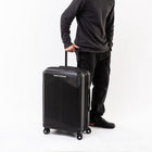Air Canada - Palma Valise Rigide Pivotante de 24 po - Noir-Poignée de chariot rétractable verrouillable à bouton-poussoir