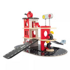Janod - Coffret de jouets pour caserne de pompiers-Les pompiers peuvent glisser le long du poteau pour passer à l'action.