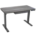 Motionwise - Bureau de la série M2 48 po de largeur, Motionwise - Bureau électrique assis-debout avec double moteurs et tiroir coulissant - Gris Rustique-Réglage électrique de la hauteur : Changez facilement entre position assise et debout avec une hauteur ajustable entre 28 po et 48 po, réduisant les douleurs dorsales et améliorant la posture grâce à un système robuste à double moteur offrant des ajustements plus rapides et plus fluides