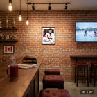 Frameworth - Macklin Celebrini collage signature replica Hockey Canada 2026 - impression encadree - 16" x 20"-Collage professionnel presentant plusieurs photos d'action avec reproduction de signature replica. Cadre en composite de bois noir avec protection en verre veritable