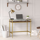 Hudson&Canal - Bureau Eaton 36" - Laiton/noyer-Le bureau présente un espace inférieur ouvert avec une barre transversale enveloppante
