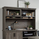 Sauder - 433683 La Collection Aspen Post Surmeuble - Finition Pebble Pine-Les portes encadrées en verre trempé de sécurité se rabattent et se verrouillent en position.